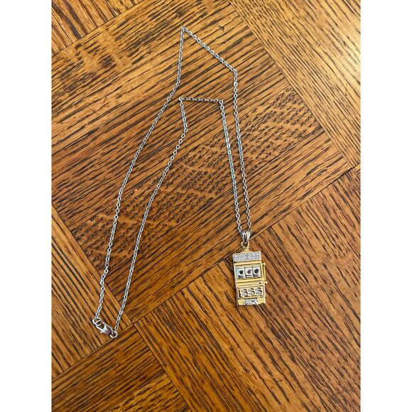 Costume jewelry gambling charm gold town, and silver tone necklace - Picture 1 of 4